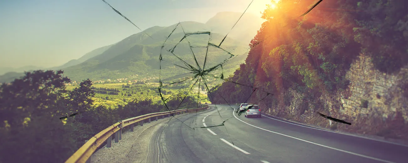 Broken windscreen on road