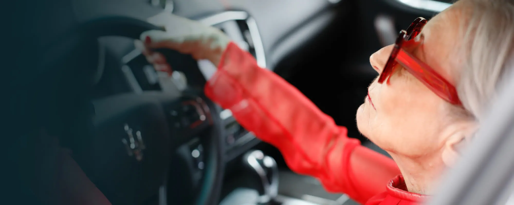 Woman driving with red jacket