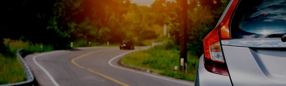 Two cars turning on the road